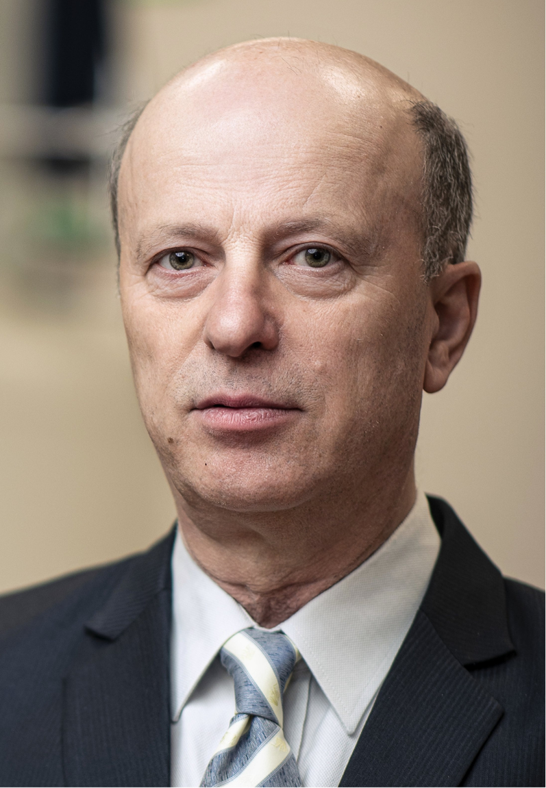 Portrait photograph of Prof Janez Plavec. An elegantly dressed man with grey hair. His face is serious.