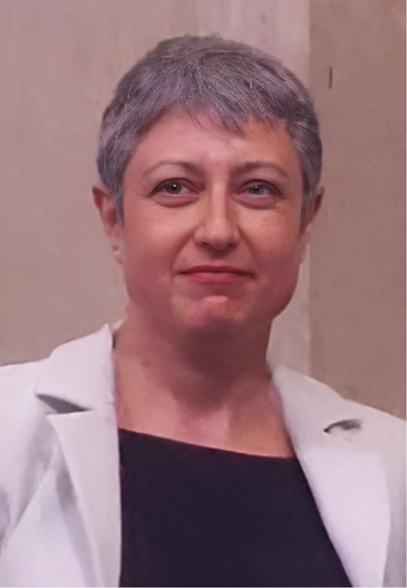 Portrait photograph of Prof. Paola B. Arimondo. Elegantly dressed woman with short grey hair, smiling slightly.