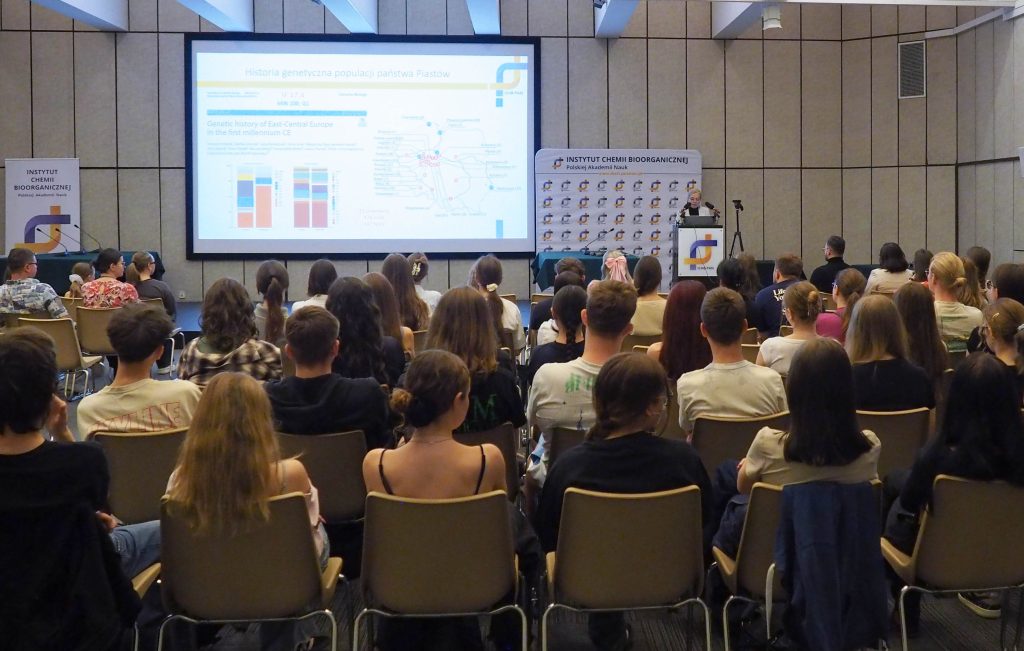 A large group of young people listening to Prof Magdalena Luczak's speech in the conference room