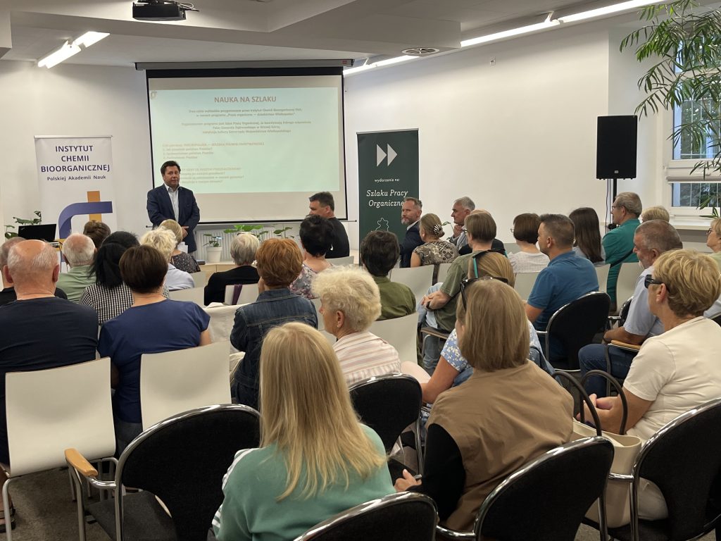 A group of people attentively listens to the Deputy Mayor of Kościan Municipality, Mirosław Duda, as he opens the event. 
