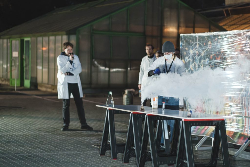Scientists during a nighttime demonstration.