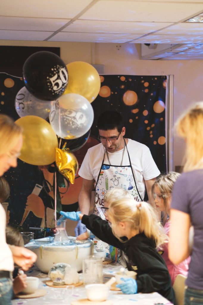 Scientists during a demonstration for children.